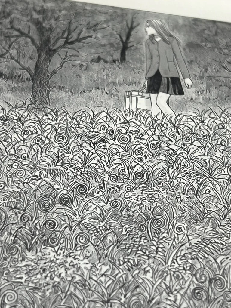 A page of Junji Ito's Uzumaki manga displayed on the Libra 2's e-ink screen.